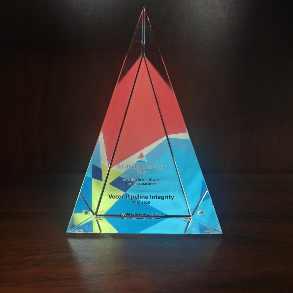 Triangular glass trophy with colorful geometric design