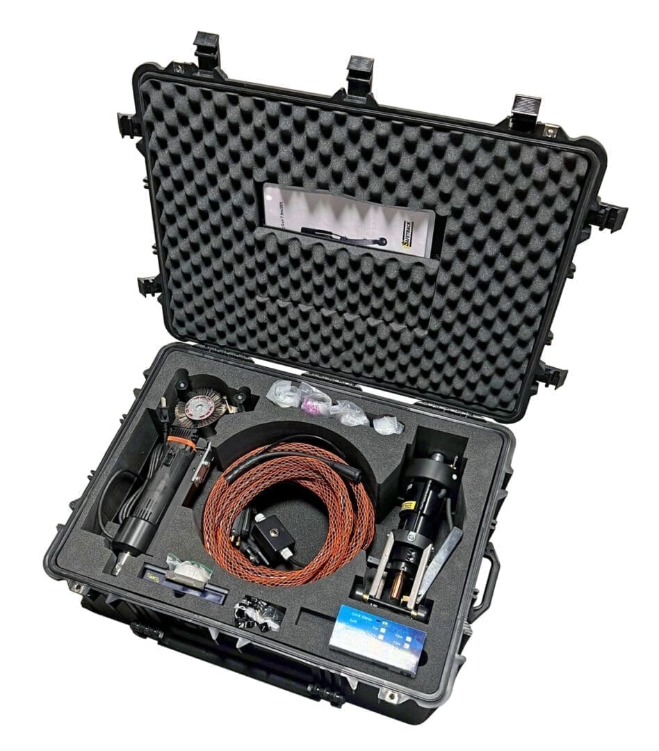 Foam-lined hard case with equipment and cable