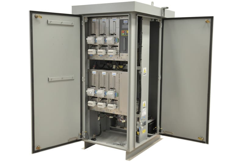 Open industrial electrical control cabinet with modules