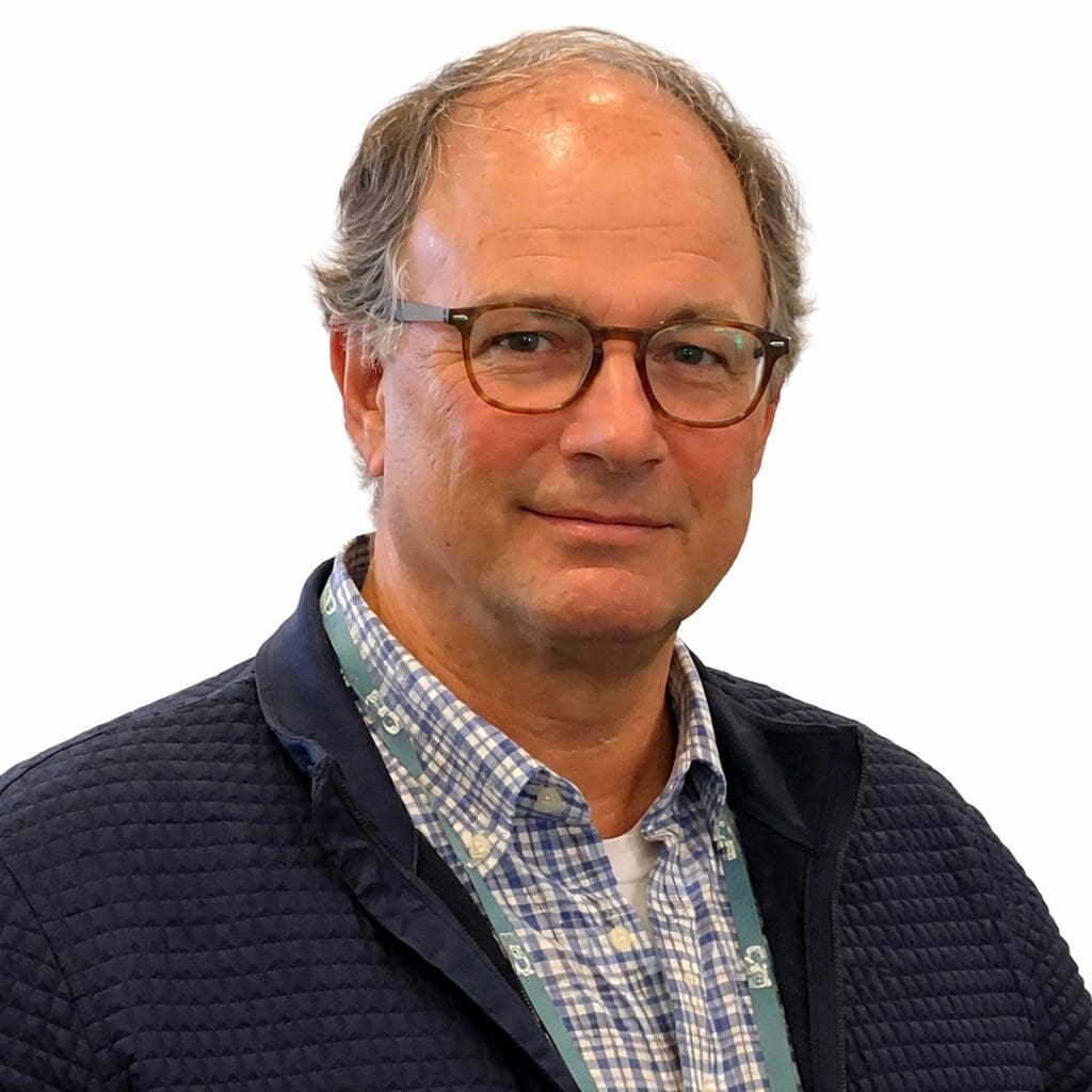 Middle-aged man wearing glasses and plaid shirt