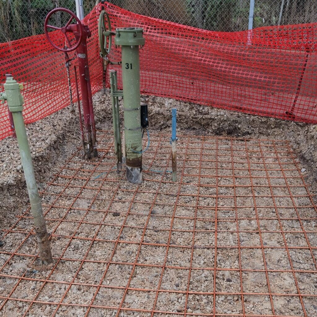 Rebar grid with utility pedestals and fencing